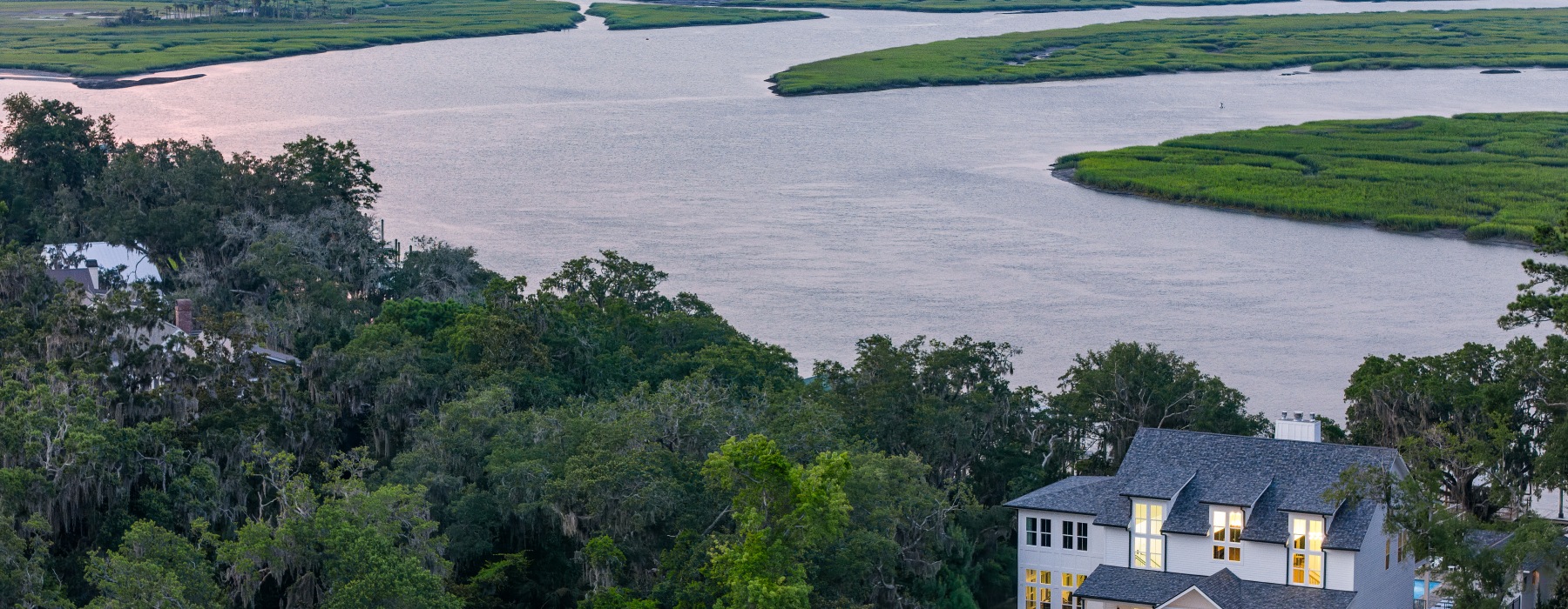 the clubhouse with battery creek behind it